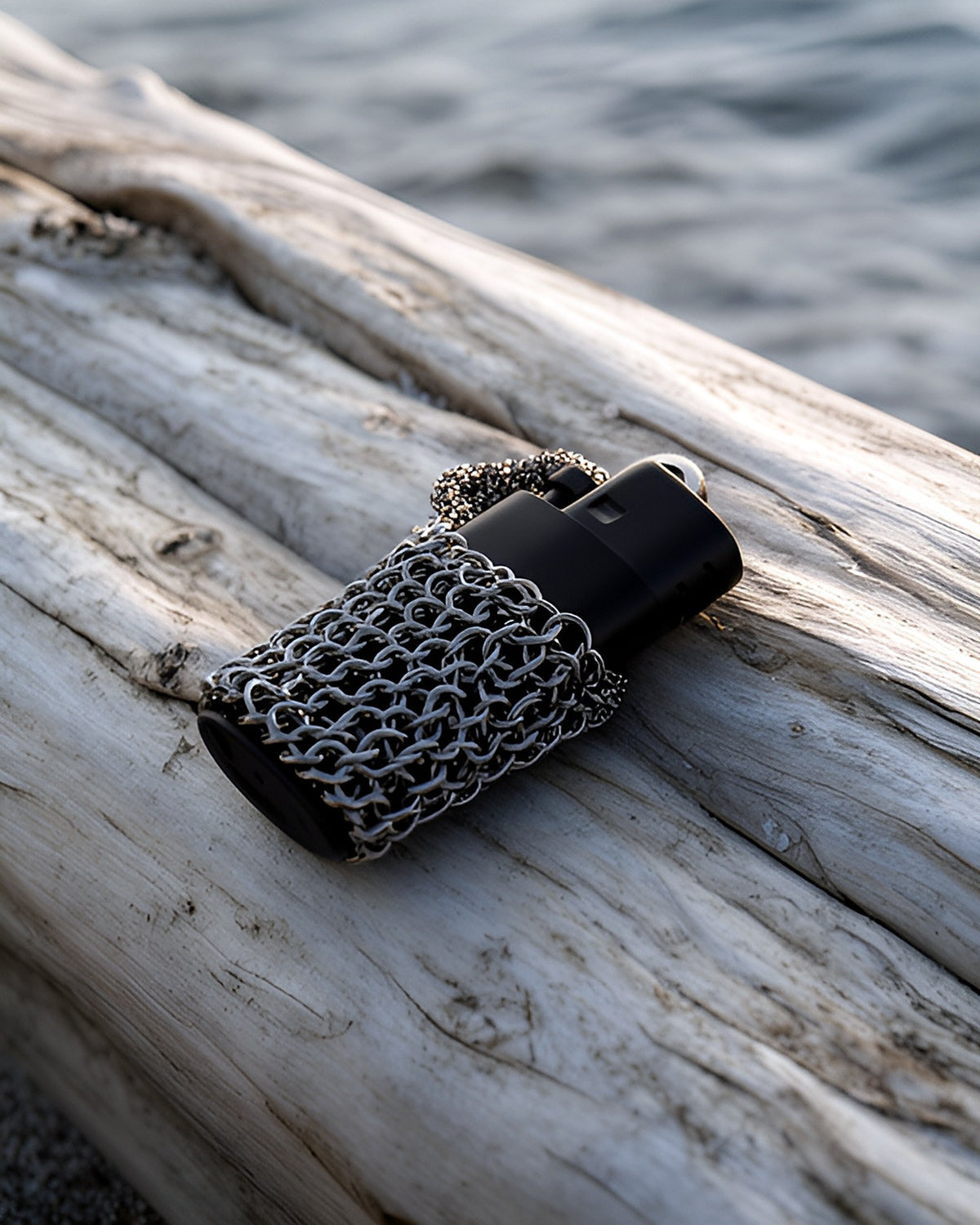 CM-01 lighter sleeve — on driftwood