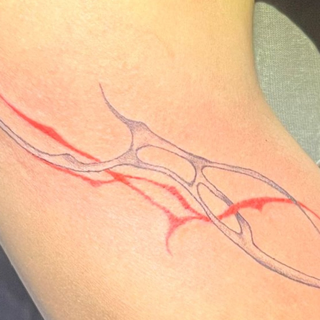 IN-02 custom tattoo — healed custom piece
