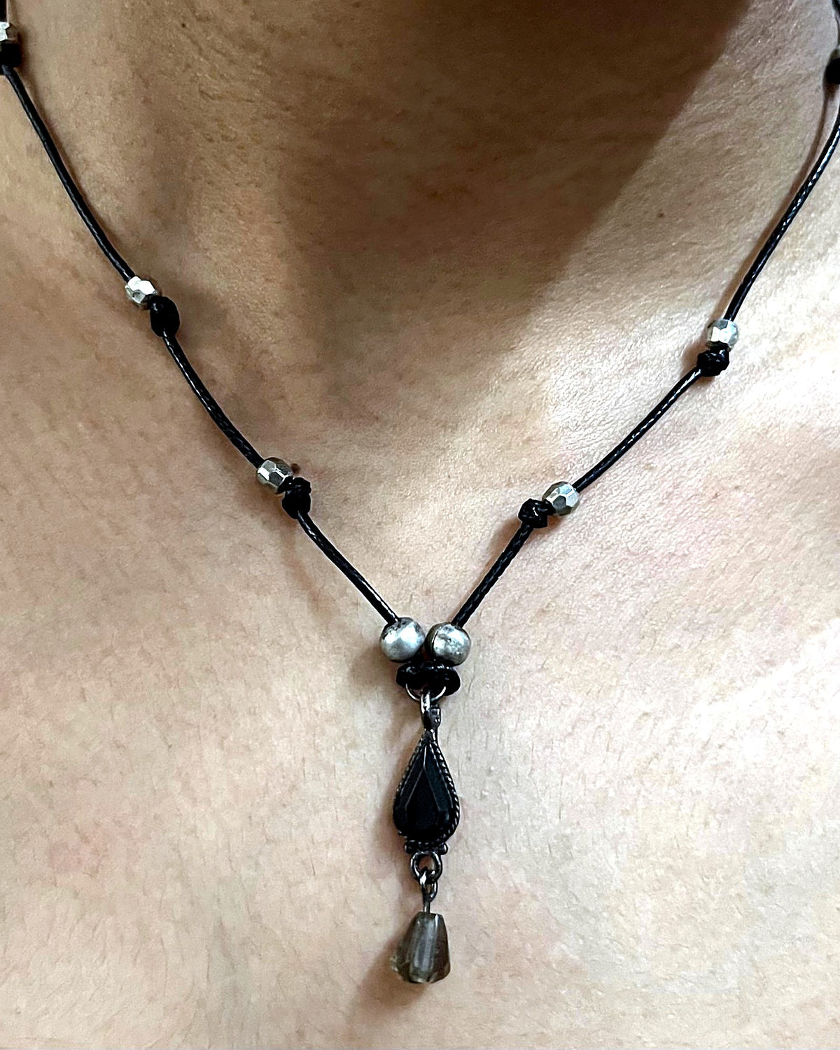 NK-04 black teardrop y-necklace, round beads — the actual piece, worn