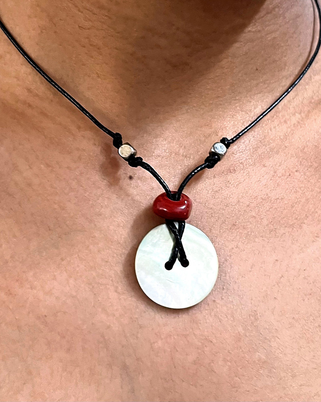 NK-05 mother-of-pearl disc pendant — the actual piece, worn
