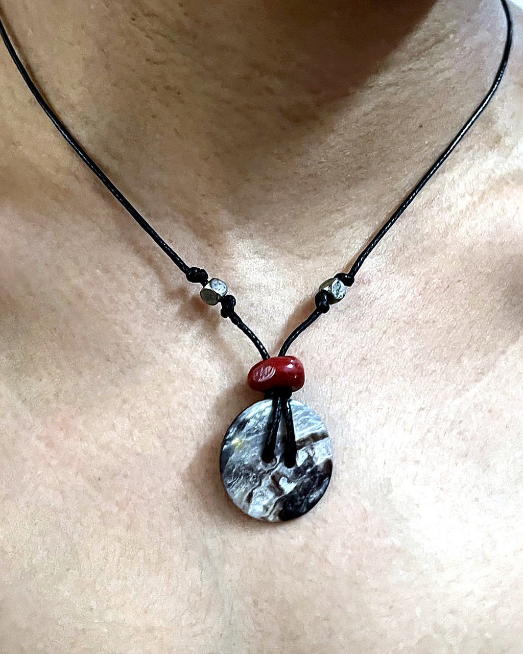 NK-06 abalone disc pendant — the actual piece, worn