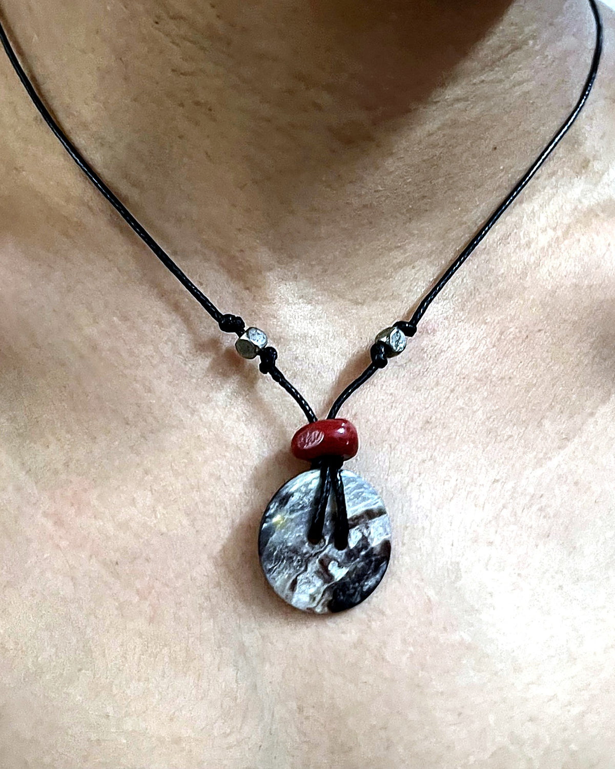 NK-06 abalone disc pendant — the actual piece, worn