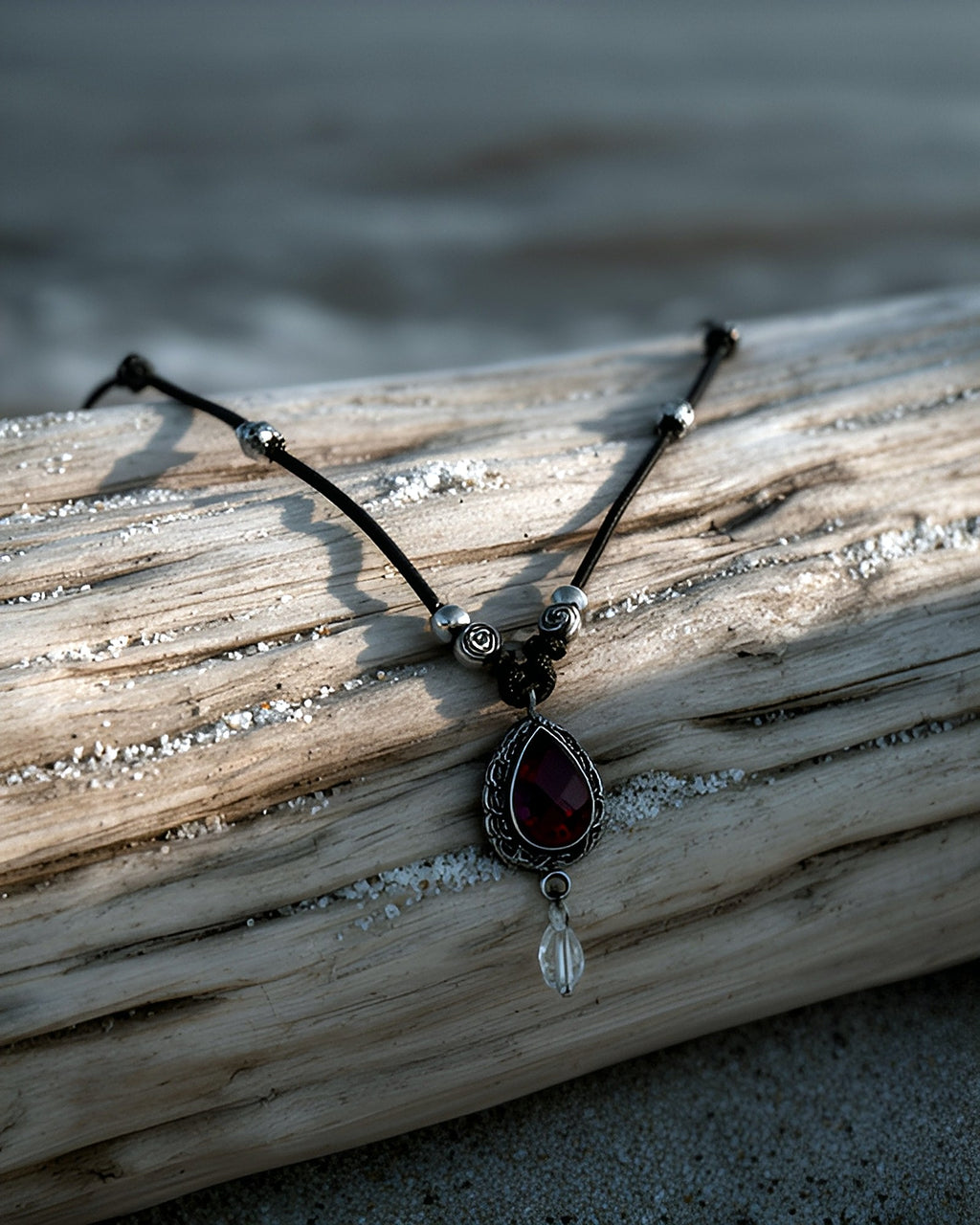 NK-08 garnet teardrop y-necklace — on driftwood